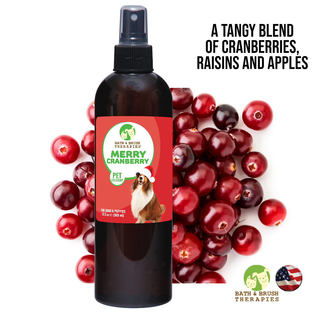 Merry Cranberry Pet Cologne in 12.5 ounce bottle placed in front of a pile of cranberries in the background. 